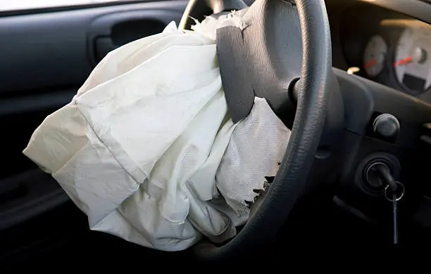 Attorney examining vehicle airbag defect evidence for a product liability claim