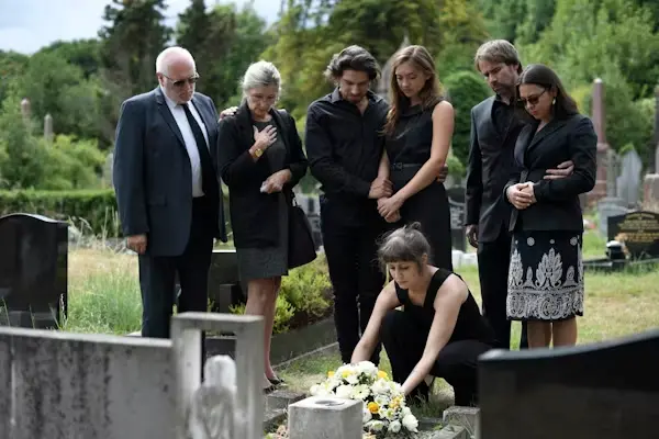 Lawyer comforting family members while explaining wrongful death case process