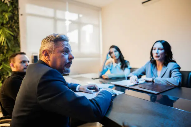 Wrongful death lawyer meeting with grieving family to discuss legal case