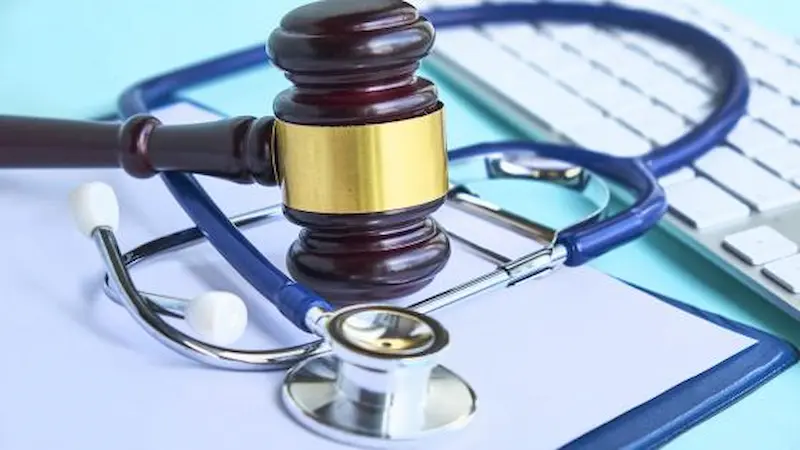 Lawyer presenting evidence at healthcare arbitration hearing.